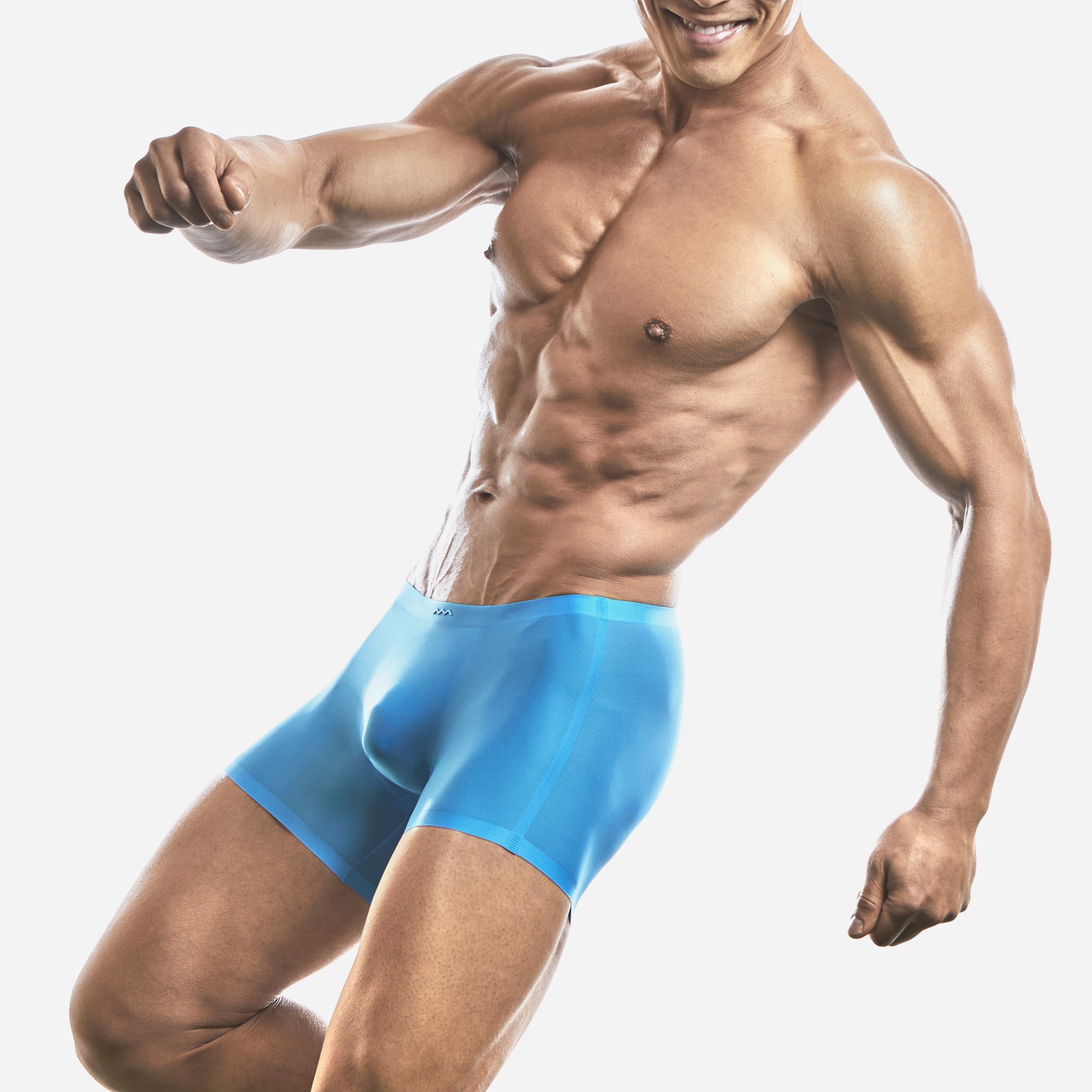 Front view of a man wearing a blue boxer brief underwear designed to fit snugly and has a sleek look